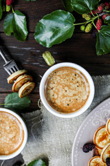 Cup of coffee with froth in a vintage cup. Table setting for breakfast. View from above. Flat lay.