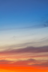 Amazing deep blue and orange colors sunset sky gradient vertical background