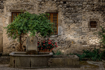 Fototapeta na wymiar Fountain in the heart of a medieval village