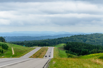 View of a highway through valleys and hills in the distance from the Anniston Eastern Bypass in...