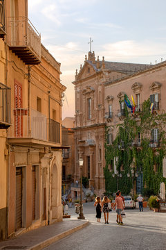 Agrigento, Sicilia, Italy - 18 August 2020 - Tourists walk on via Atenea towards piazza Pirandello