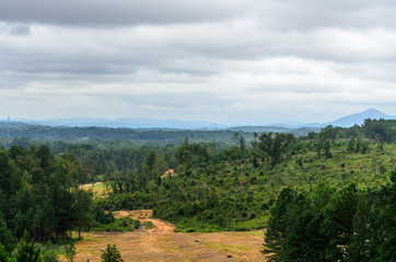 View of valleys and hills in the distance from the Anniston Eastern Bypass in Alabama, USA on a cloudy day