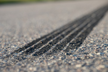Tire footprints on asphalt