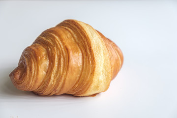 Close up fresh croissant on white background.