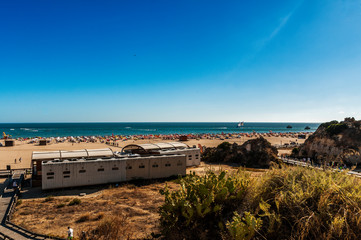 Da Rocha Beach. Great beach located in the town of Portimao. Fine sand beach, turquoise waters. Surrounded by cliffs, huge rocks and caves.
