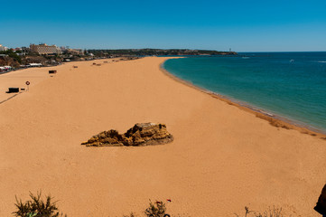 Da Rocha Beach. Great beach located in the town of Portimao. Fine sand beach, turquoise waters. Surrounded by cliffs, huge rocks and caves.