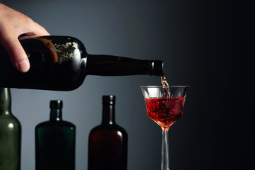 Aged golden fortified sherry being poured into a crystal glass.