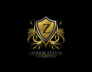 Gold Royal Shield Z Letter Logo. Graceful Elegant gold shield icon design.