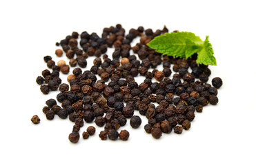 Black pepper on a white background and isolated