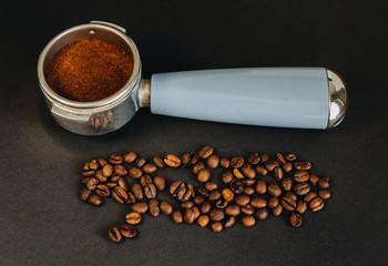 Espresso filter holder for coffee machine on Black background with copy space