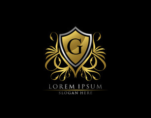 Gold Royal Shield G Letter Logo. Graceful Elegant gold shield icon design.