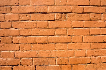 The texture of the wall is made of brick painted in red.