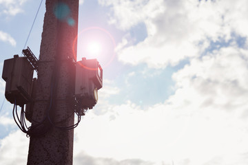 electric meters on a pole, the concept of rising utility rates