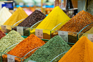 Various bright colored powder spices on market in Istanbul, Turkey