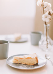 Piece of apple pie on plate with cup of coffee. Breakfast with coffee and cake in cafe. Food photography Table top photo