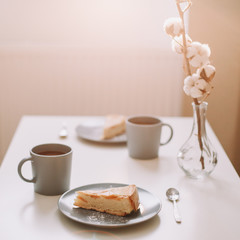 Piece of apple pie on plate with cup of coffee. Breakfast with coffee and cake in cafe. Food photography Table top photo