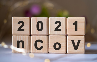 Coronavirus, text 2020 nCoV concept on wooden cubes. COVID-19, novel corona virus disease 2019 from Wuhan.