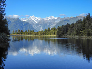 Mt Cook behind a placid lake in New Zealand