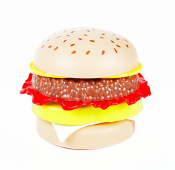 Toy plastic burgers on white background, isolate, close-up