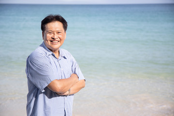 Confidence Asian Middle Age Man with Arms Crossed Gesture
