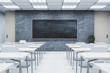 Classroom interior with empty blackboard,
