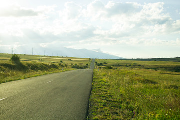 Fototapeta na wymiar long road and fields