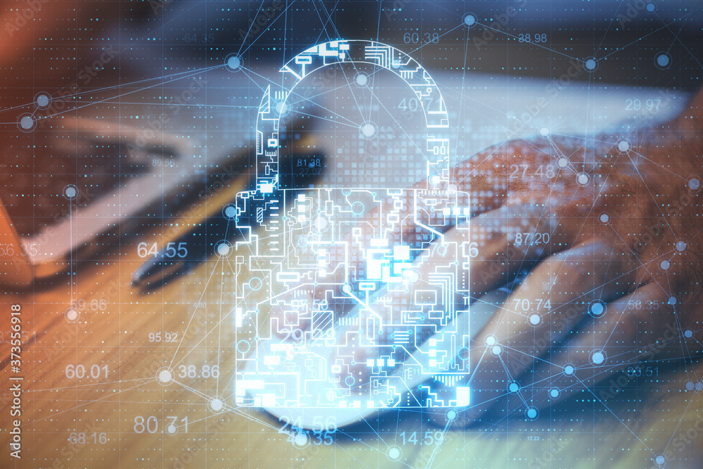 Poster Close up of  hands using laptop with glowing  circuit padlock.
