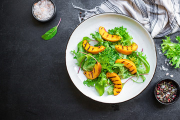 salad peach grilled lettuce leaves mix nectarine ingredient natural serving size healthy top view place for text copy space keto or paleo diet raw