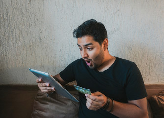 man shopping online with a tablet
