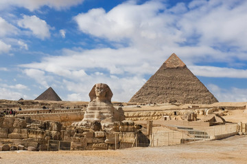 Sphinx and  Giza Pyramids in a cloudy day - Cairo, Egypt
