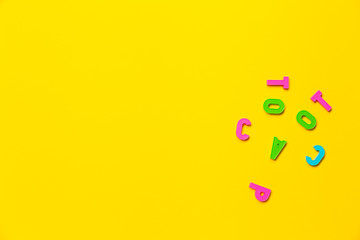 Face is depicted using plastic toy colored alphabet letters. Concept of humor that reflects the mood of a student or teacher. Banner with free space for text on the topic of education or psychology