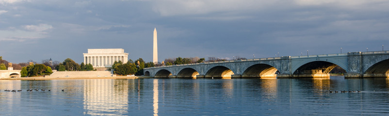Lincoln Memorial and Washington Monument and Memorial Bridge over Potomac River in a cloudy day -...