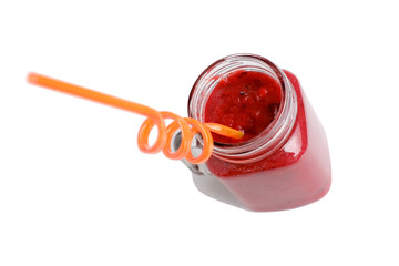 mason jar mug with a fruit, berry smoothie in his hand, a colored tube, the concept of raw food, healthy refreshing drinks, vitamin diet, weight loss, isolated