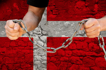 male hands break the iron chain, a symbol of bondage,protest against the background of national...