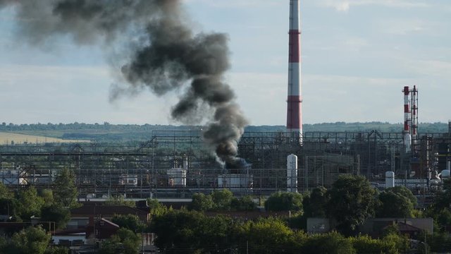 Accident at petrochemical plant - strong fireand smoke. Ecological catastrophe