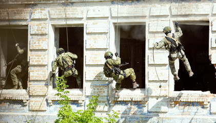 Special forces soldiers storm the walls