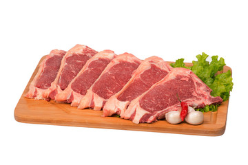 fresh and raw beef on cutting board on white background