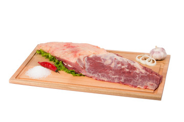 fresh and raw beef on cutting board on white background