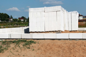Street lighting. Start building a white block residential building. Laying takes place on an...