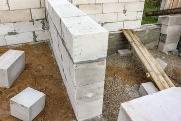 Street lighting. Start building a white block residential building. Laying takes place on an...