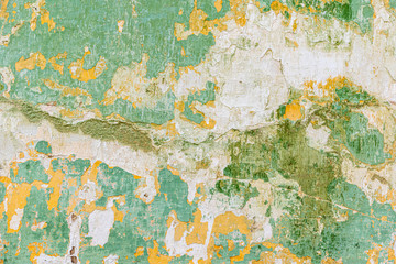 Old wall with peeling paint green