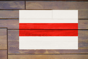 Belarusian protest flag painted on a wooden wall