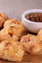 typical Brazilian snack: tapioca dumpling with honey