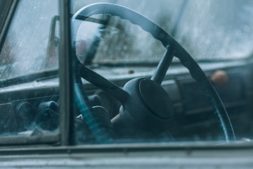 Vintage steering wheel. Salon of an old car.