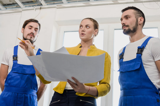 Woman discusses with the contractor the details of house building