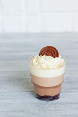 Delicious chocolate  trifles in a glassl. Dessert Three Chocolates, selective focus.