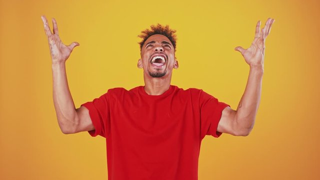 Desperate african american man talking to God, shouting for help but not hearing answer
