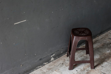 The vintage plastic chair with dark background