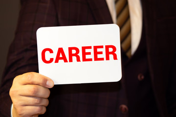 Compass and card with word CAREER on white background, closeup. Promotion concept