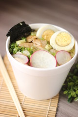 Ramen noodle soup with eggs and radish